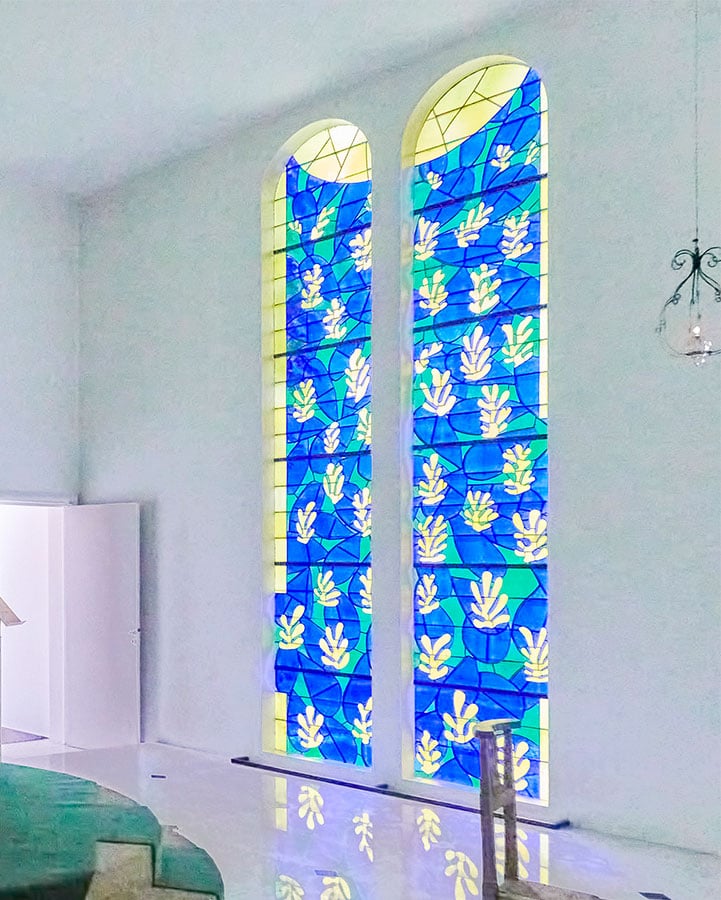 Two blue, yellow and green coloured windows.