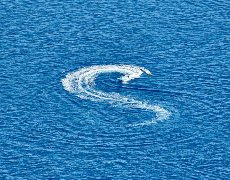 The sea being moved by a jet ski.