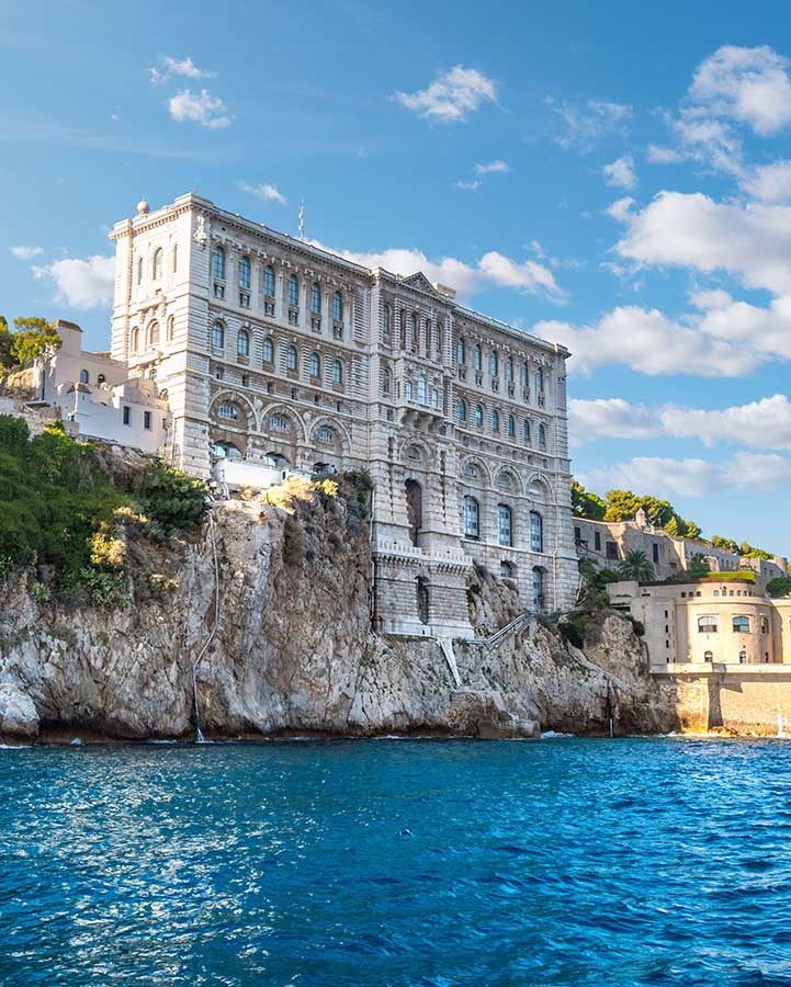 A building on a rock on the sea coast.