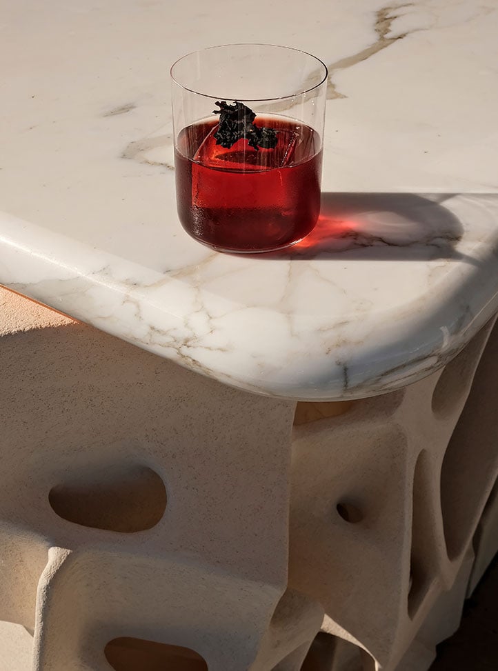A red cocktail on the Ceto bar table.