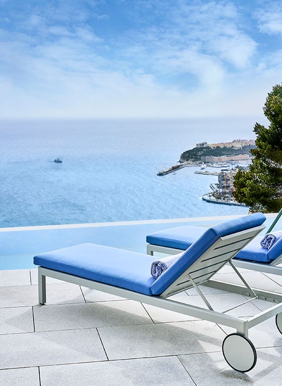 Grand Duplex Pool Suite at The Maybourne Riviera - Sun chairs on the terrace next to the private swimming pool with view onto the sea