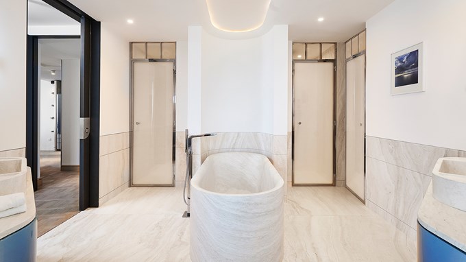 Grand Riviera Suite - bathroom with marble bath in the middle.
