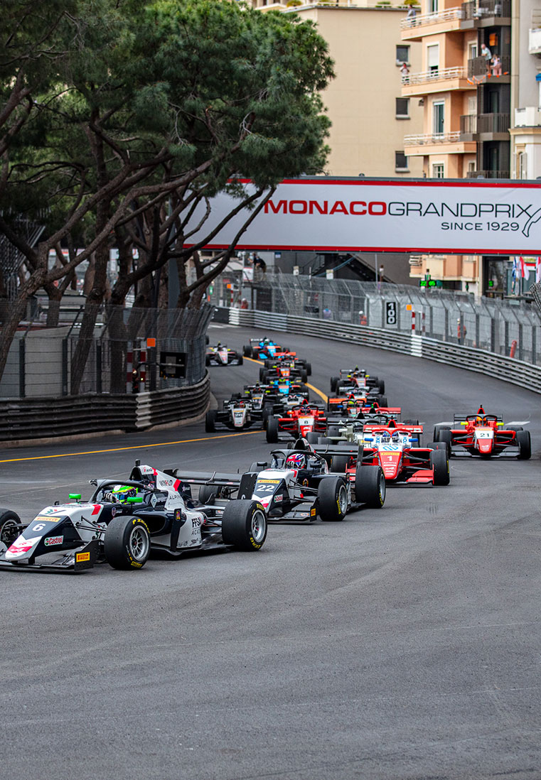 Row of F1 cars on track