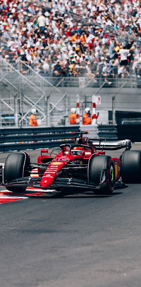 Ferrari F1 car driving on the Grand Prix track in Monaco