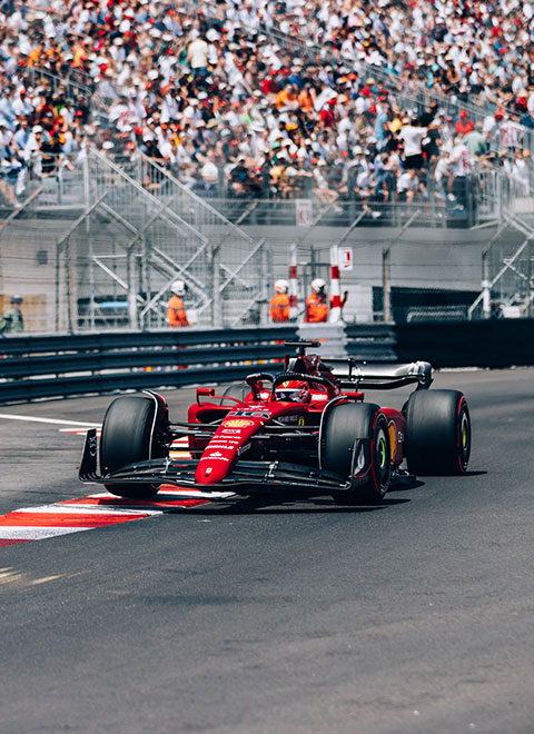 Ferrari F1 car driving on the Grand Prix track in Monaco