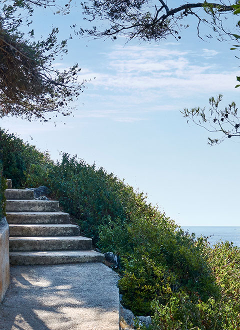 Stone stairs in the mountain with the sky in the background.