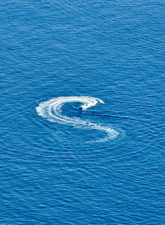 The sea being moved by a jet ski.