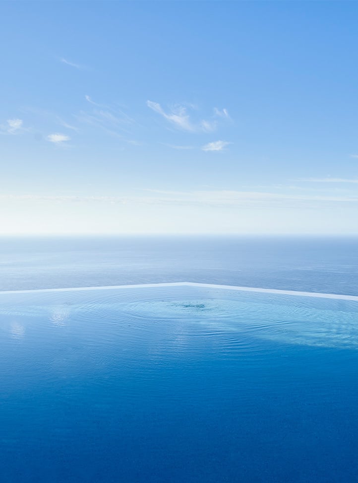 Infinity pool by the blue sky.