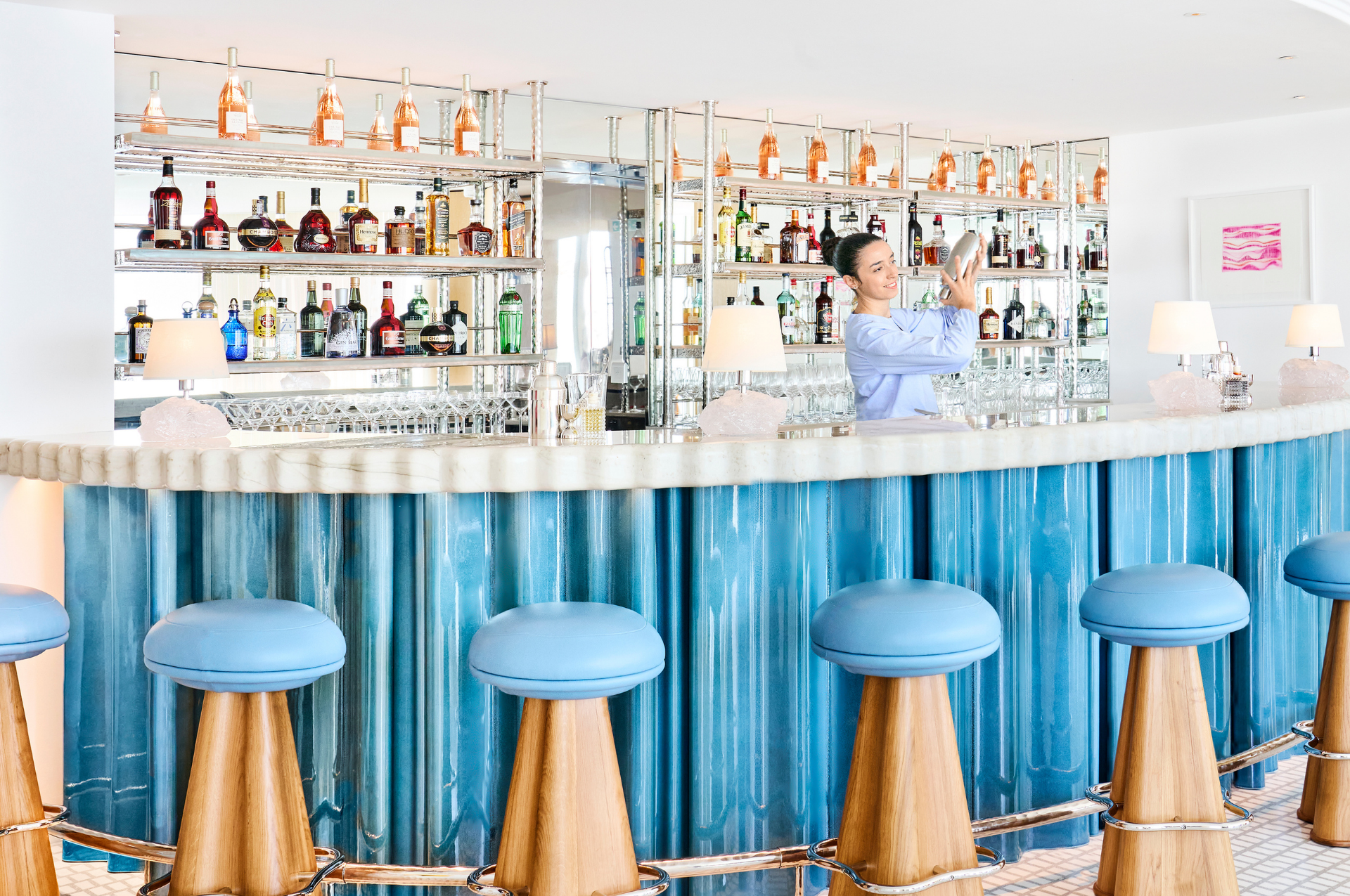 Barman behind bar checking cocktail