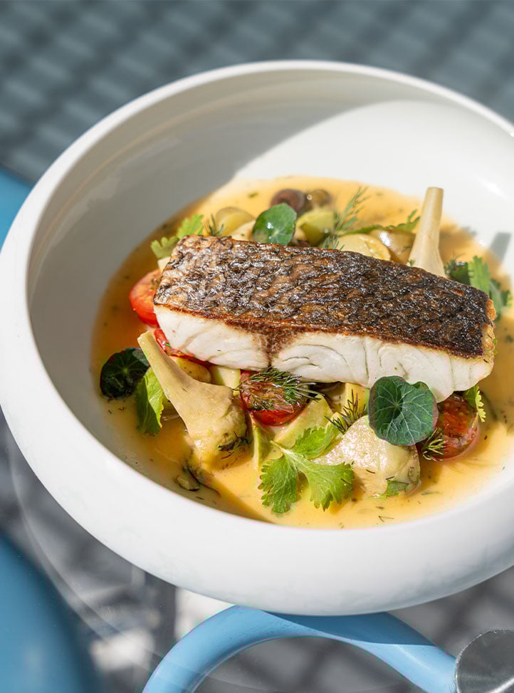 Seabass fillet with Zucchini, mussels, fresh almond, spicy tomato broth